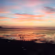 A lover walking on the tidal flats at sunset